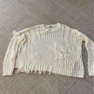 Cable and fringe sweater in cream